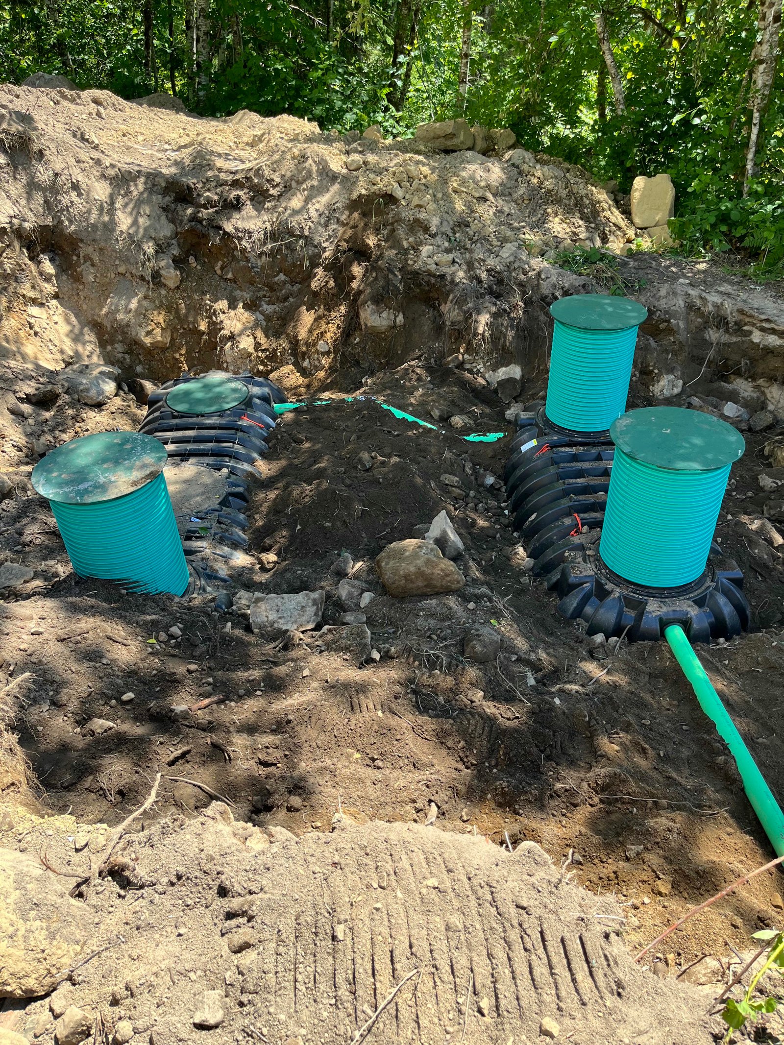 Green septic tank risers installed on a new system during a residential project in Lewis County, WA